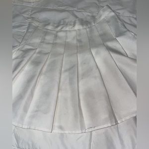 White tennis style skirt.